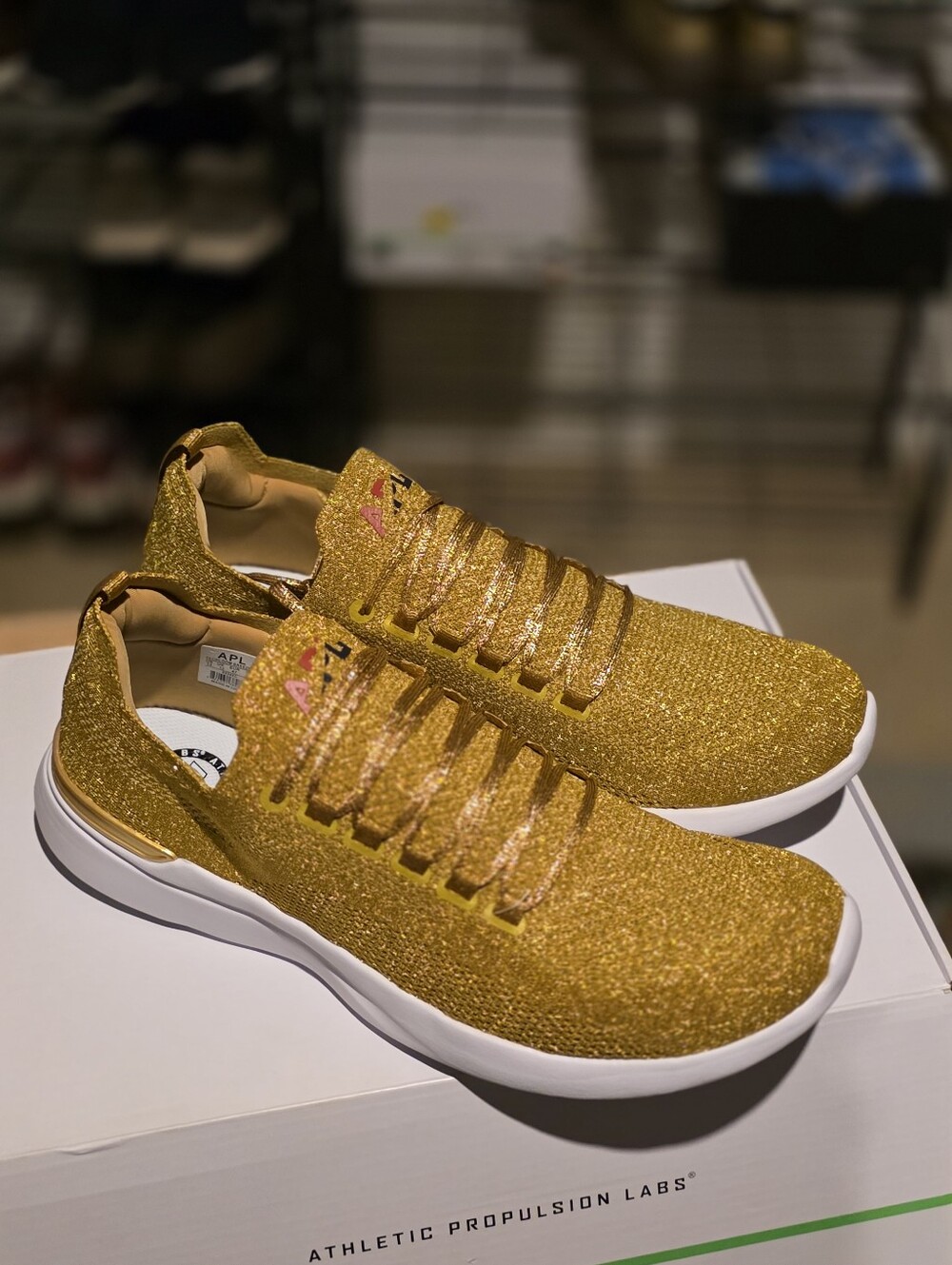APL Metallic Gold Knit Slip-On Sneakers